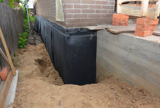 Happy homeowners after waterproofing job in Martin